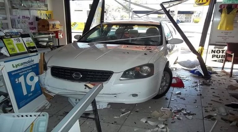 Driver Runs Car Almost Completely Inside of Store