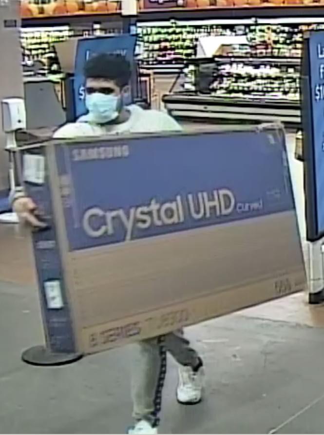 Man Walks Out of Walmart With Stolen 52 Inch TV