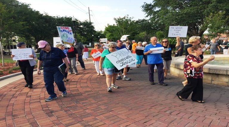 Local Protesters Join Nationwide Rally To “Release The Report”